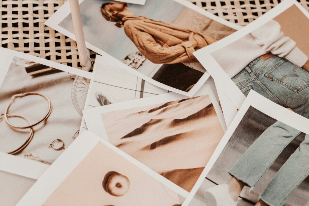 choosing a fashion market agency - lookbook images on a wicker tabletop